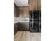 Laundry room featuring stackable washer and dryer units, sleek cabinetry, countertop, and modern tile backsplash at 4040 E Mclellan Rd # 16, Mesa, AZ 85205