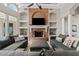 Living room with a brick fireplace, built-in shelves, and two gray sofas at 4040 E Mclellan Rd # 16, Mesa, AZ 85205