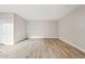 Spacious living room featuring light wood-look tile flooring and neutral wall paint throughout at 4040 E Mclellan Rd # 16, Mesa, AZ 85205
