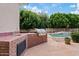 Built-in outdoor kitchen with stainless steel grill and sink, ideal for summer barbecues and gatherings at 4040 E Mclellan Rd # 16, Mesa, AZ 85205