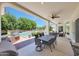 Covered patio with outdoor dining, grill, and lounge area overlooking the pool at 4040 E Mclellan Rd # 16, Mesa, AZ 85205