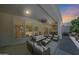 Spacious covered patio with ample seating, ceiling fans, and a cozy fireplace, ideal for entertaining and enjoying the outdoors at 4040 E Mclellan Rd # 16, Mesa, AZ 85205