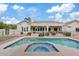 Backyard pool and spa with a fence, patio, and covered porch on the exterior of the home at 4040 E Mclellan Rd # 16, Mesa, AZ 85205