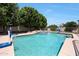 Sparkling pool with spa, lush landscaping, and basketball hoop for outdoor fun at 4040 E Mclellan Rd # 16, Mesa, AZ 85205