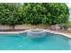 Inviting swimming pool and spa surrounded by mature landscaping, creating a private backyard oasis at 4040 E Mclellan Rd # 16, Mesa, AZ 85205