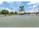 Well-maintained community tennis court surrounded by lush trees and landscaping, offering a great amenity for residents at 4040 E Mclellan Rd # 16, Mesa, AZ 85205