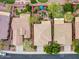 Bird's-eye view showing an expansive backyard with putting green and mature landscaping at 41318 N Belfair Way, Anthem, AZ 85086