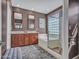 Bathroom featuring a double vanity, soaking tub, walk-in glass shower, and neutral brown color palette at 41318 N Belfair Way, Anthem, AZ 85086