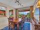 Dining area with sliding glass doors leading to an outdoor dining space at 41318 N Belfair Way, Anthem, AZ 85086