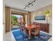 Formal dining room featuring backyard view, wood furniture, and natural light at 41318 N Belfair Way, Anthem, AZ 85086