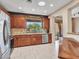 Charming kitchen with stainless steel appliances, granite countertops, and outdoor view at 41318 N Belfair Way, Anthem, AZ 85086