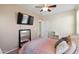 Light filled bedroom with a flat screen TV at 43525 W Cydnee Dr, Maricopa, AZ 85138