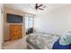 Bedroom with a bed with blue accents and a window at 43525 W Cydnee Dr, Maricopa, AZ 85138