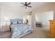 Cozy bedroom featuring neutral walls, a bed, and a sliding mirror closet at 43525 W Cydnee Dr, Maricopa, AZ 85138