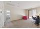 Bonus room features neutral carpet, big window, desk area, and lots of open space at 43525 W Cydnee Dr, Maricopa, AZ 85138