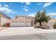 Spacious two-story home with a three car garage and a well-manicured front yard at 43525 W Cydnee Dr, Maricopa, AZ 85138