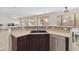 Kitchen sink area featuring tiled backsplash and stainless steel dishwasher at 43525 W Cydnee Dr, Maricopa, AZ 85138