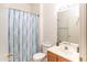 Compact bathroom features a single vanity, toilet, and shower-tub combination with shower curtain at 455 S Mesa Dr # 104, Mesa, AZ 85210