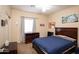 Neutral toned bedroom featuring ceiling fan, a window and a standard-sized closet at 455 S Mesa Dr # 104, Mesa, AZ 85210
