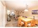 Open concept living area with dining table and chairs at 455 S Mesa Dr # 104, Mesa, AZ 85210