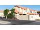 Exterior view of Tamaron Village featuring red tile roofs and stucco walls with privacy fence at 455 S Mesa Dr # 104, Mesa, AZ 85210