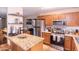 Well-lit kitchen features stainless steel appliances and a beautiful granite countertop island at 455 S Mesa Dr # 104, Mesa, AZ 85210
