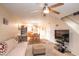 Cozy living room with a ceiling fan, carpet, and comfortable seating at 455 S Mesa Dr # 104, Mesa, AZ 85210