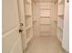 Organized walk-in closet with adjustable shelving and rods, offering ample storage space for clothes and accessories at 461 W Lindbergh Ave, Coolidge, AZ 85128