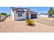 Charming home with a well-maintained yard, attractive landscaping, and a two car garage at 461 W Lindbergh Ave, Coolidge, AZ 85128