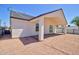 Back exterior of the home showcasing the patio and gravel landscaping at 461 W Lindbergh Ave, Coolidge, AZ 85128