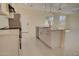 Modern kitchen featuring white cabinets, stainless steel appliances, and a sleek island at 461 W Lindbergh Ave, Coolidge, AZ 85128