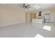 Bright living room open to the kitchen with sleek tile floors and modern lighting fixtures at 461 W Lindbergh Ave, Coolidge, AZ 85128
