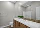 A well-lit bathroom features a vanity, decorative mirror, and decorative accent at 4777 S Fulton Ranch Blvd # 2071, Chandler, AZ 85248