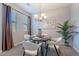 Inviting dining room featuring neutral walls, bright windows, chandelier and a table set for four at 4777 S Fulton Ranch Blvd # 2071, Chandler, AZ 85248
