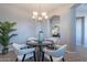 Cozy dining room featuring a chandelier, round table with seating for four, and elegant decor at 4777 S Fulton Ranch Blvd # 2071, Chandler, AZ 85248