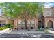 Charming multi-story home with stone facade, manicured landscaping, and a shade tree at 4777 S Fulton Ranch Blvd # 2071, Chandler, AZ 85248