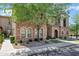 Beautiful home featuring stone exterior, arched entryway, manicured landscaping, and mature tree at 4777 S Fulton Ranch Blvd # 2071, Chandler, AZ 85248