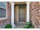 Inviting entryway features a gray front door flanked by white columns and stone accents at 4777 S Fulton Ranch Blvd # 2071, Chandler, AZ 85248