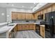 Modern kitchen features bright countertops, warm wood cabinets, and stainless steel appliances at 4777 S Fulton Ranch Blvd # 2071, Chandler, AZ 85248