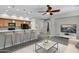 Bright and airy living room with a kitchen bar, ceiling fan, modern furnishings and gray color scheme at 4777 S Fulton Ranch Blvd # 2071, Chandler, AZ 85248