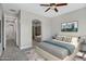 Spacious bedroom featuring a ceiling fan, neutral gray tones, and entry to bathroom at 4777 S Fulton Ranch Blvd # 2071, Chandler, AZ 85248