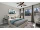 Relaxing bedroom with natural light, modern art, ceiling fan, and neutral color palette at 4777 S Fulton Ranch Blvd # 2071, Chandler, AZ 85248