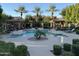 A beautiful community pool surrounded by lounge chairs and shade structures at 4777 S Fulton Ranch Blvd # 2071, Chandler, AZ 85248