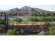 Scenic lake view with lush landscaping, mountain views, and walking path at 525 W Lakeside Dr # 151, Tempe, AZ 85281