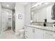 Bright bathroom features a single sink, granite countertops, and a walk-in shower at 5250 E Deer Valley Dr # 247, Phoenix, AZ 85054