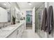 Bright bathroom features dual sinks, granite countertops, and a walk-in shower at 5250 E Deer Valley Dr # 247, Phoenix, AZ 85054