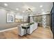 Modern dining room with elegant lighting, artwork, and a full dining set at 5250 E Deer Valley Dr # 247, Phoenix, AZ 85054