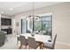 Dining room with modern light fixture and sliding glass doors providing access to an outdoor patio at 5250 E Deer Valley Dr # 247, Phoenix, AZ 85054