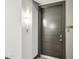 Apartment entryway features a modern door and stylish wall sconce lighting at 5250 E Deer Valley Dr # 247, Phoenix, AZ 85054