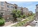 An apartment building showcasing manicured landscaping, pedestrian walkways, and outdoor patios at 5250 E Deer Valley Dr # 247, Phoenix, AZ 85054